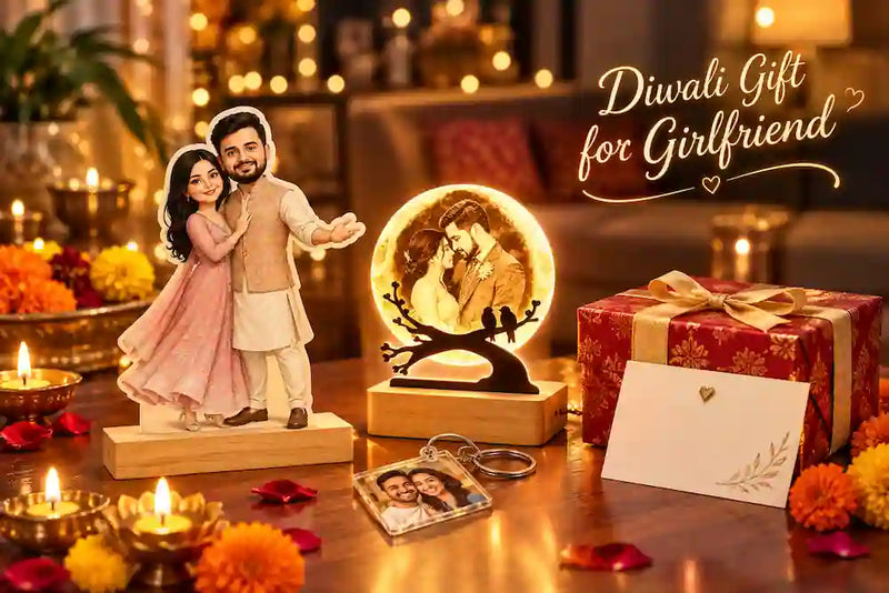 Personalised diwali gift for girlfriend: moon lamp, couple caricature standee and a wrapped gift beside lit diyas