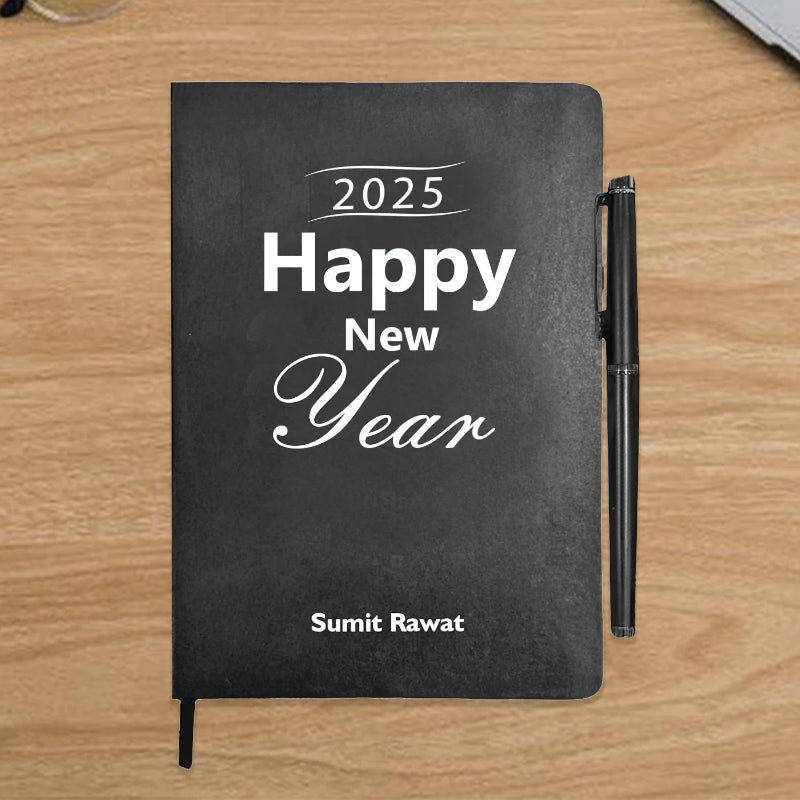 Black notebook with '2025 Happy New Year' text on a wooden surface