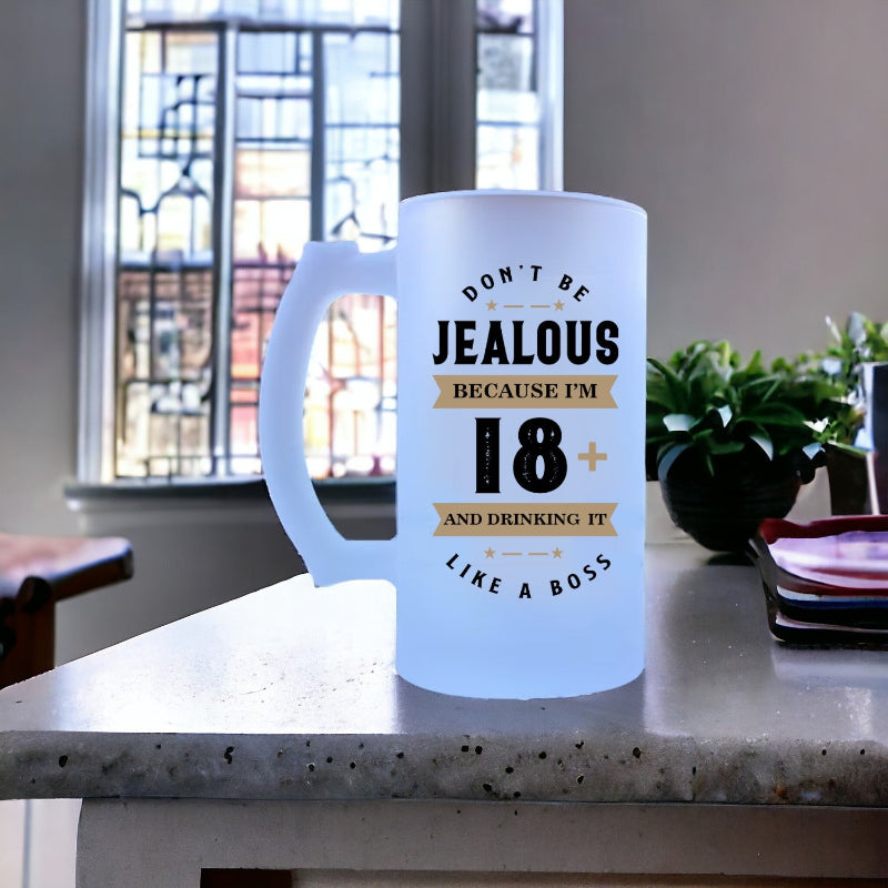Frosted mug with humorous text on a kitchen counter