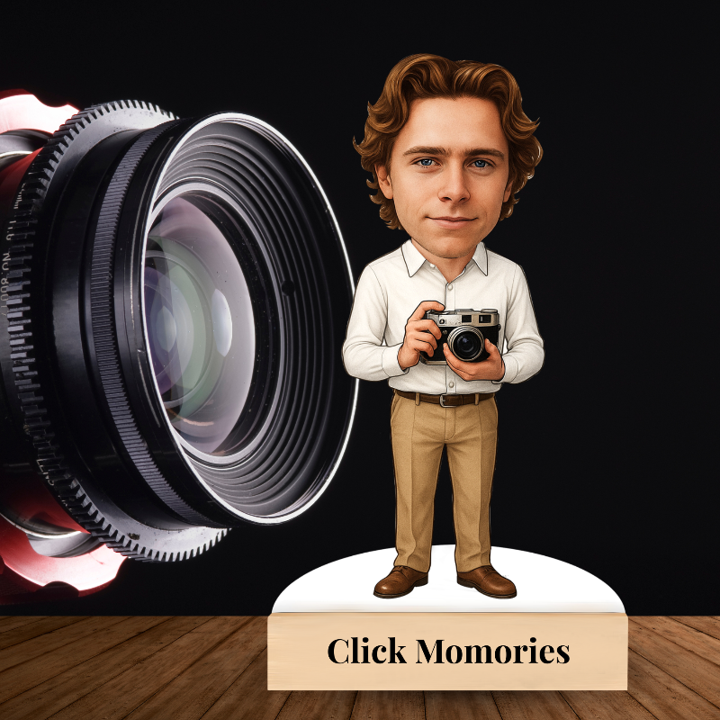 Caricature of a person holding a camera with a large camera lens and 'Click Memories' text on a wooden surface.