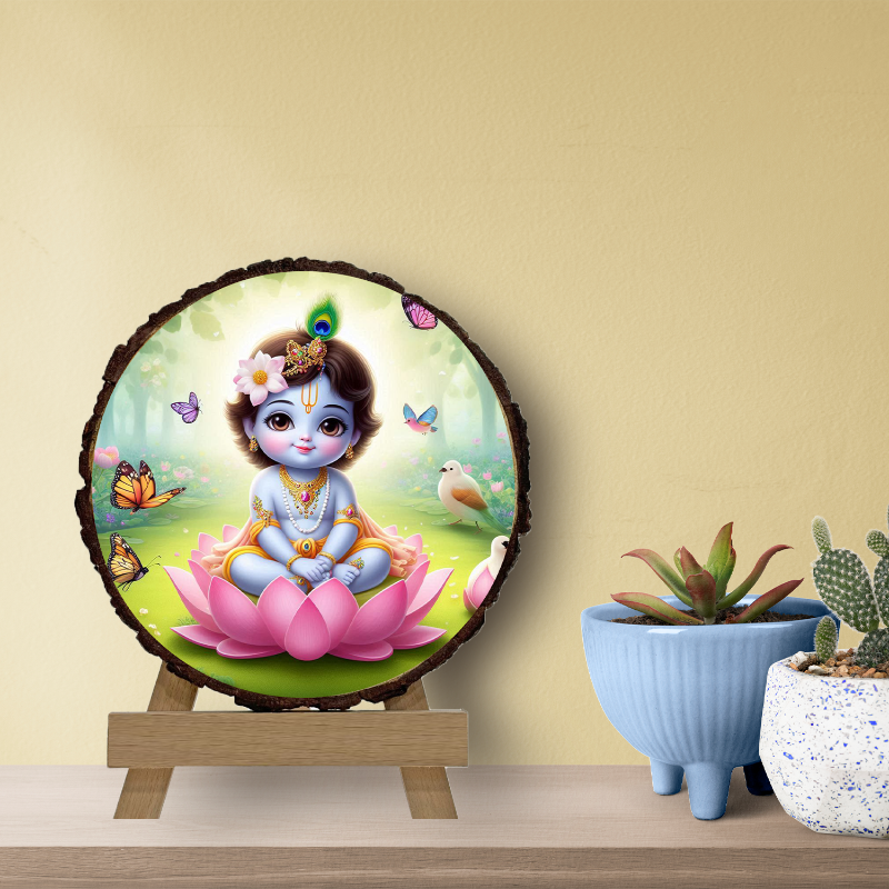 A circular wooden picture frame featuring an illustration of baby Krishna with a serene expression, surrounded by a natural wood texture, with decorative elements like butterflies and flowers in the background.