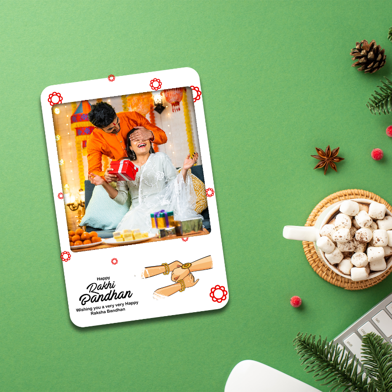 Card with a couple exchanging gifts on a green background with festive decorations.