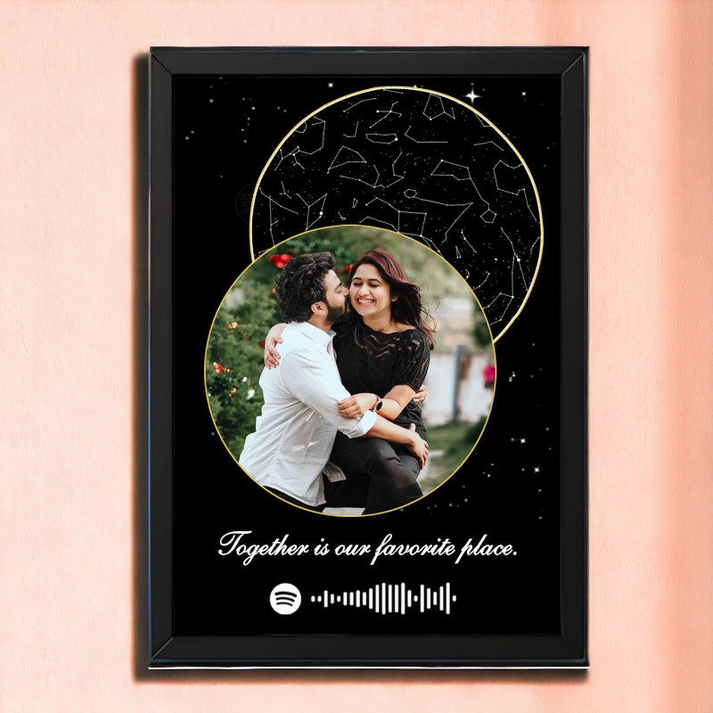 A personalized all-in-one star map frame with a black border, featuring a couple embracing, with a background of stars and constellations, and a textual message that says 'Together is our favorite place.'.