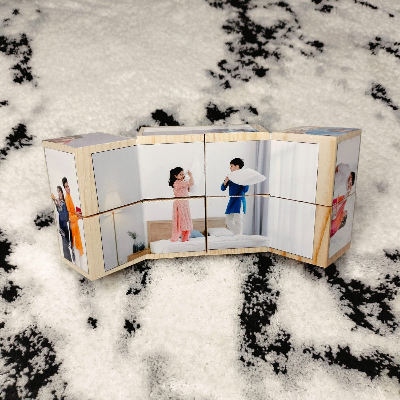 Wooden photo album with multiple pages showing people in different poses on a snowy background.