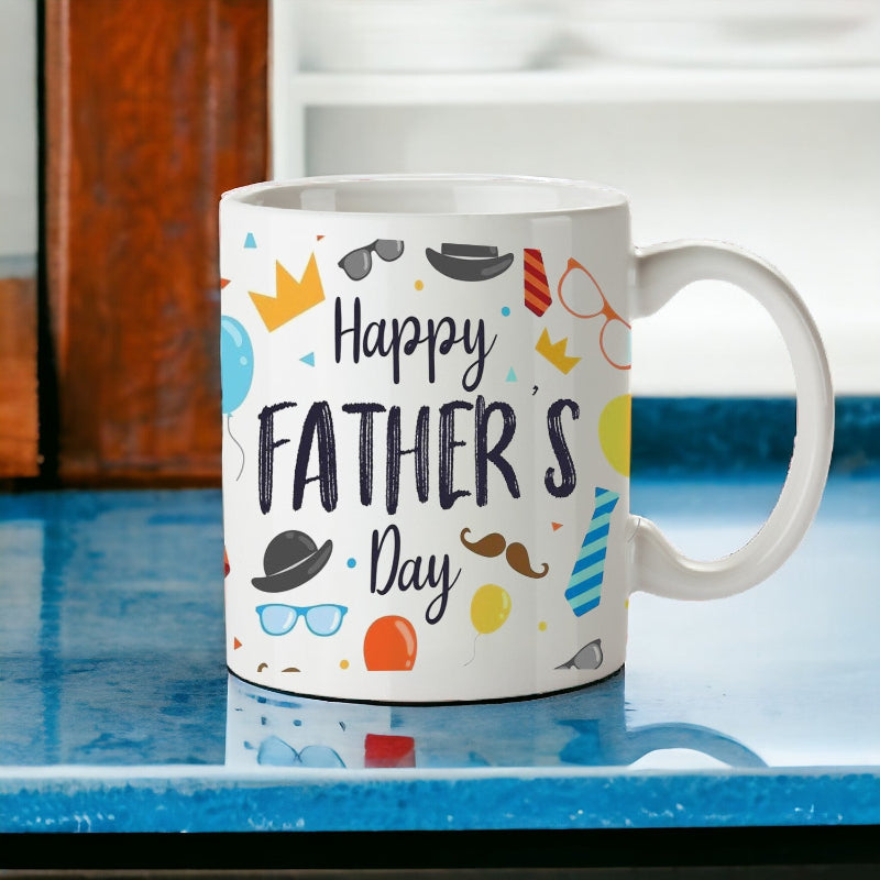White mug with 'Happy Father's Day' text and colorful graphics on a blue surface.