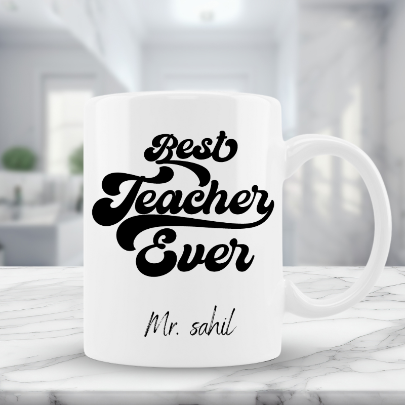 White mug with 'Best Teacher Ever' text on a marble surface