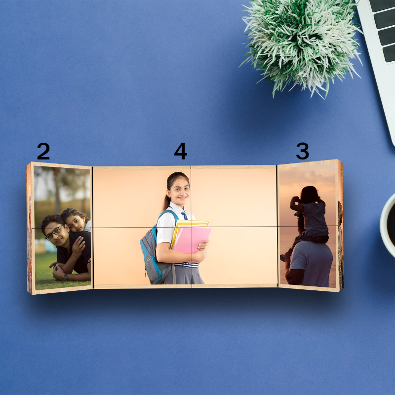 Wooden photo mosaic with four images on a blue surface with a plant and laptop.