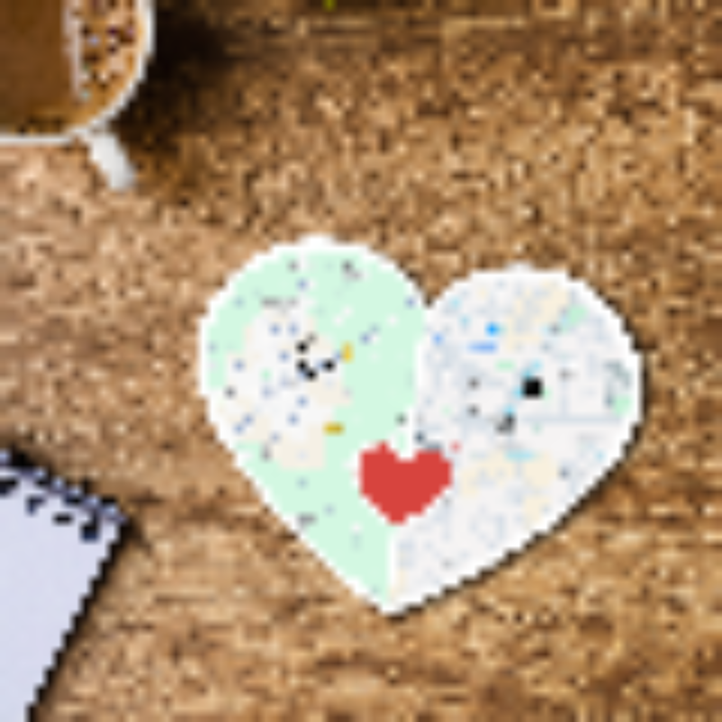 Heart-shaped sticker with a cartoon character and red heart on a cork board.