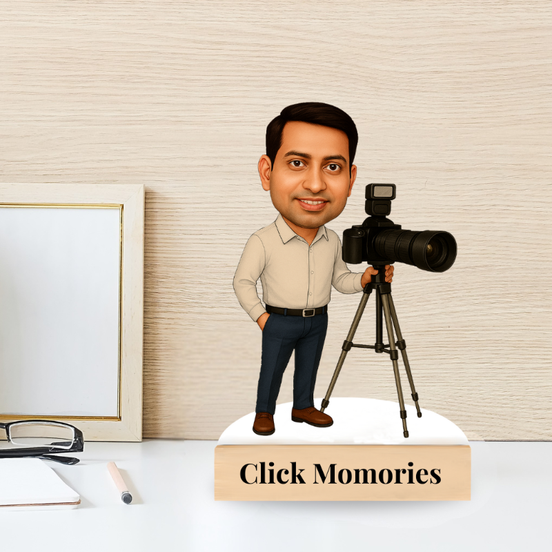 Caricature of a man holding a camera on a tripod with 'Click Memories' text on a desk.
