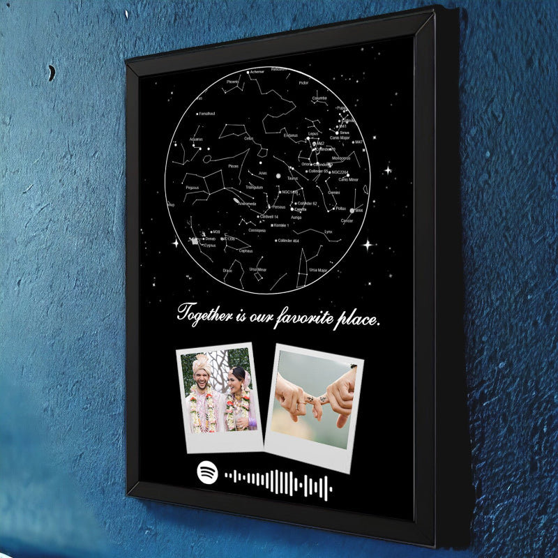 Framed artwork with star map, photos, and Spotify code on a blue wall