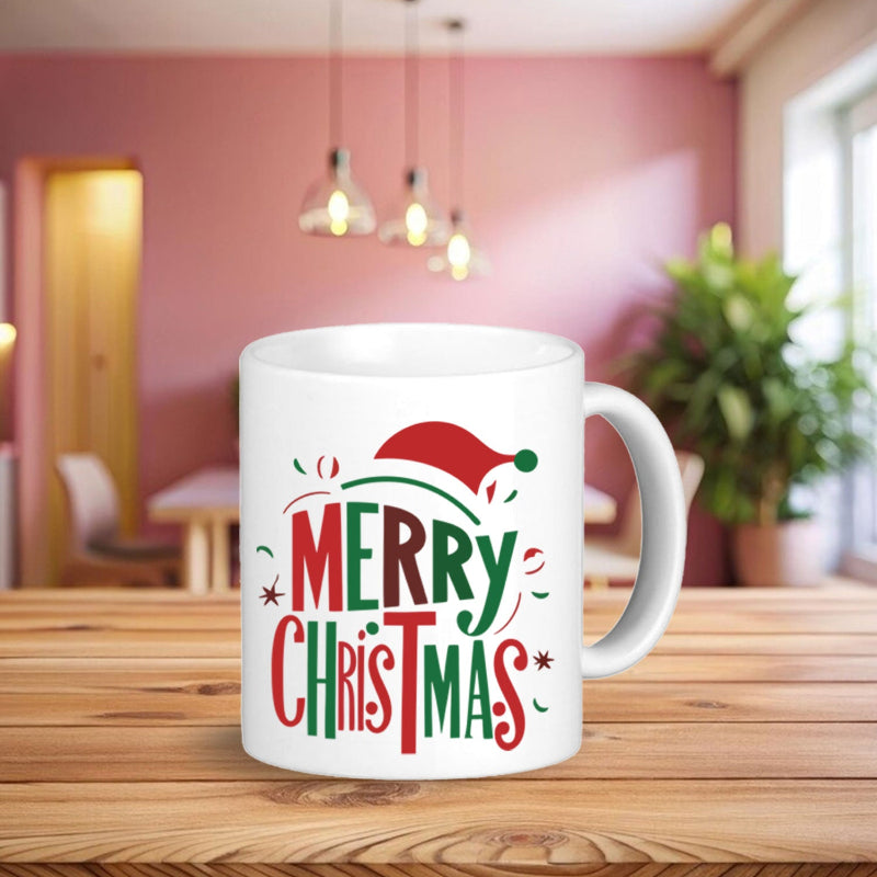 White mug with 'Merry Christmas' text and Santa hat design on a wooden table.
