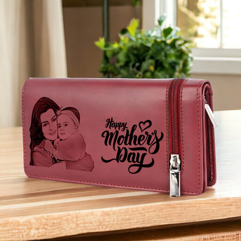 Pink wallet with a printed image of a woman and child and 'Happy Mother's Day' text on a wooden surface.