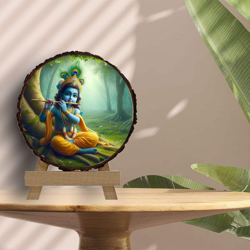 A framed picture of Lord Krishna playing the flute, set against a forest background, displayed on a wooden slice with a greenish tint, placed on a wooden easel.