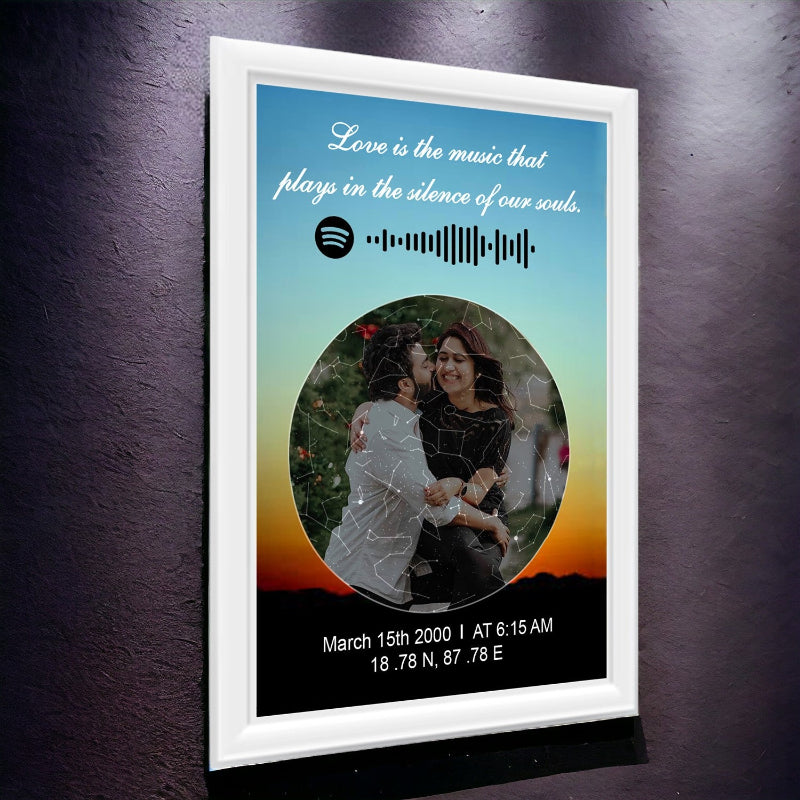 Framed artwork with a couple, quote, and coordinates on a dark wall.