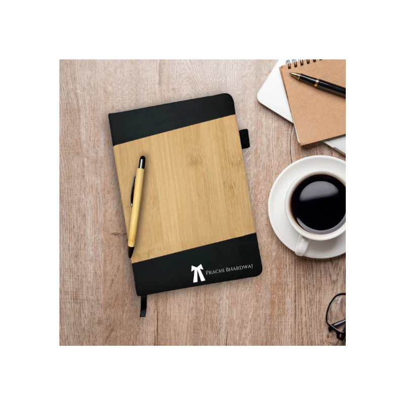 Notebook with pen and coffee cup on a wooden surface