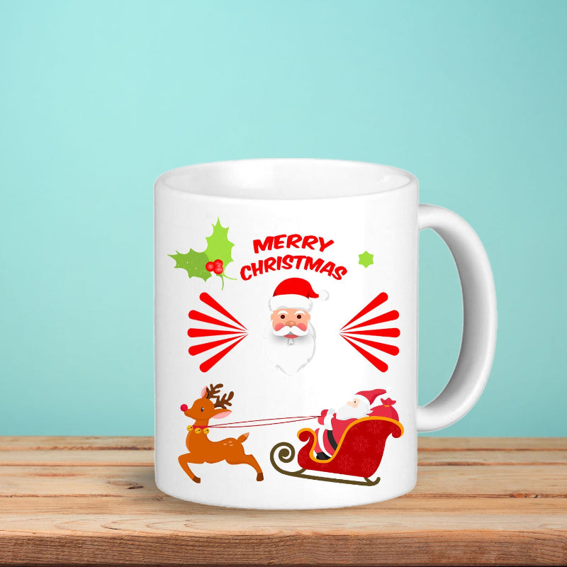 White mug with Christmas design featuring Santa Claus, reindeer, and holly on a wooden surface with a light blue background.
