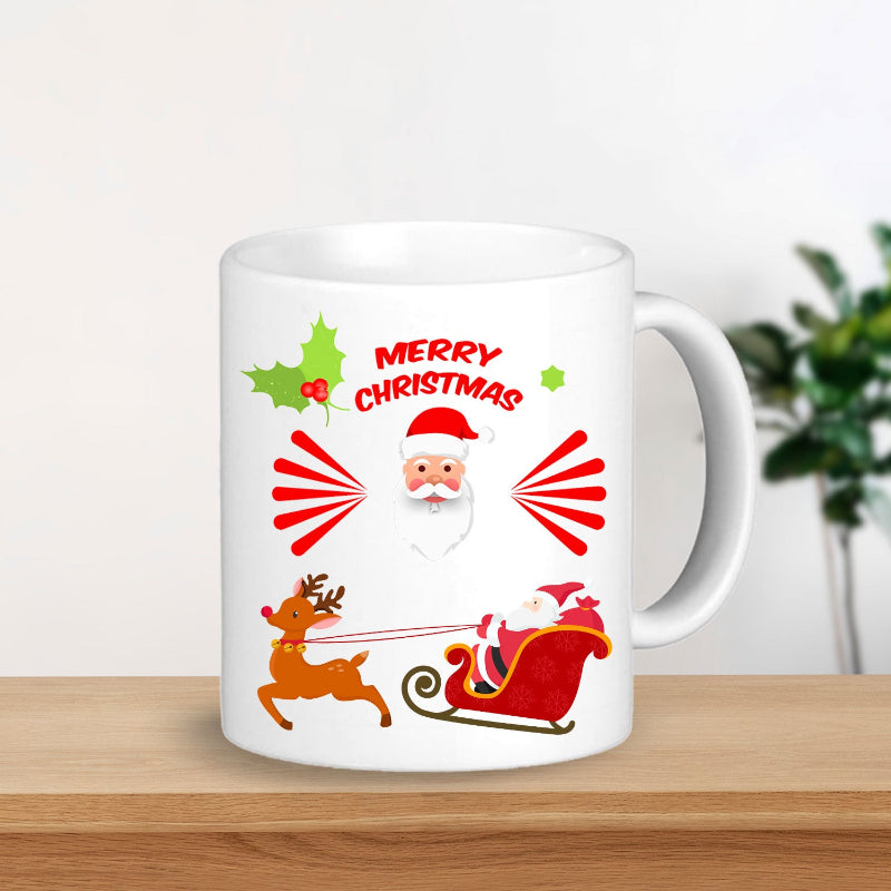 White mug with Christmas design featuring Santa Claus, reindeer, and 'Merry Christmas' text on a wooden surface.