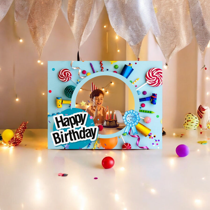 Colorful birthday card with a photo of a child blowing out candles, surrounded by decorative items.
