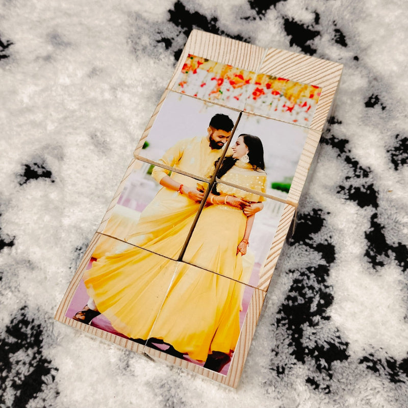 Wooden photo puzzle with a couple in yellow outfits on a snowy background