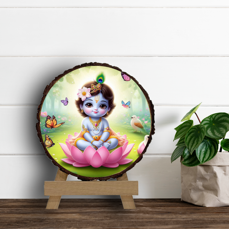 A circular wooden picture frame featuring an illustration of baby Krishna with a serene expression, surrounded by a natural wood texture, with decorative elements like butterflies and flowers in the background.