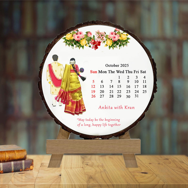 Calendar with a couple in traditional attire on a wooden stand with a blurred background
