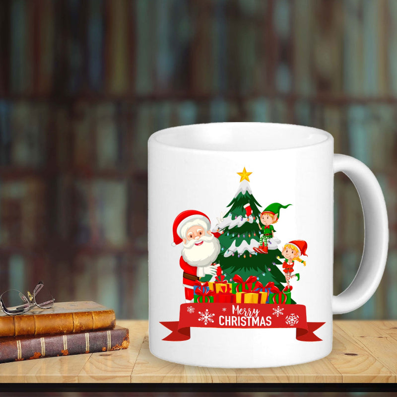 A white ceramic mug with a Christmas-themed design featuring Santa Claus, a Christmas tree, and festive decorations, with the text 'Merry Christmas' and 'Santa Claus'.