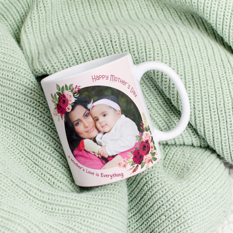Personalized mug with a photo of a mother and child and floral design on a green textured background