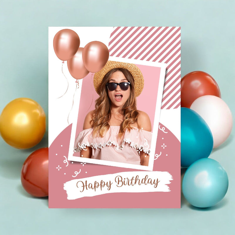 Birthday card with a photo of a woman and balloons on a light blue background