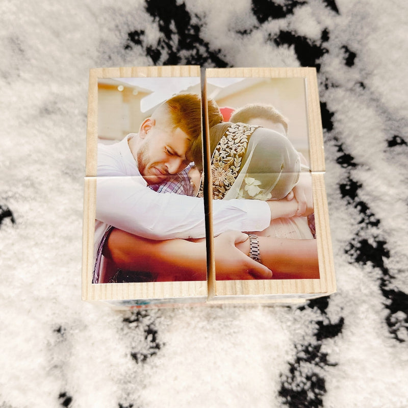 Wooden photo puzzle with two images on a marble surface