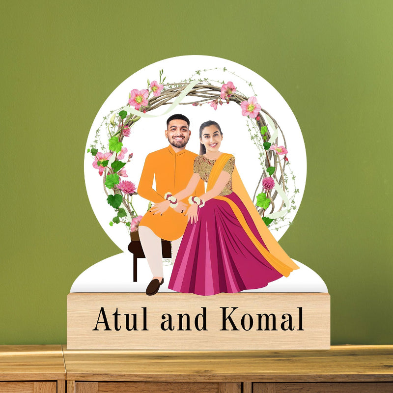 A personalized wedding caricature portrait featuring a couple in a circular frame, surrounded by floral elements and decorative borders.