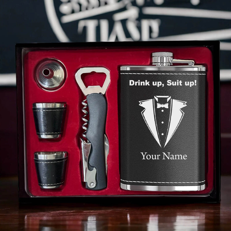 Black flask set with personalized name on a red interior background