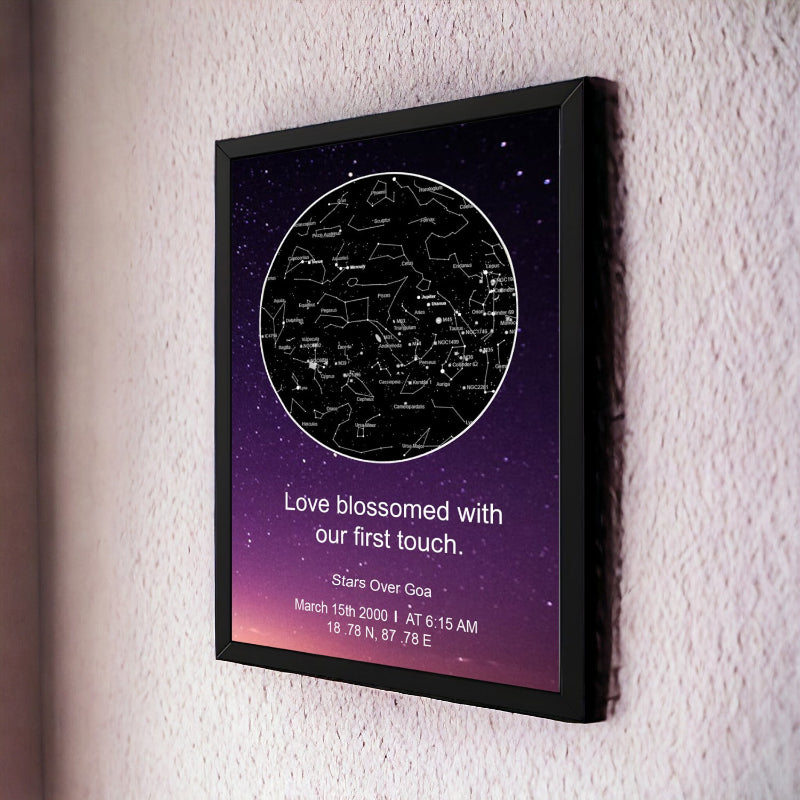 Framed star map poster with personalized text on a wall