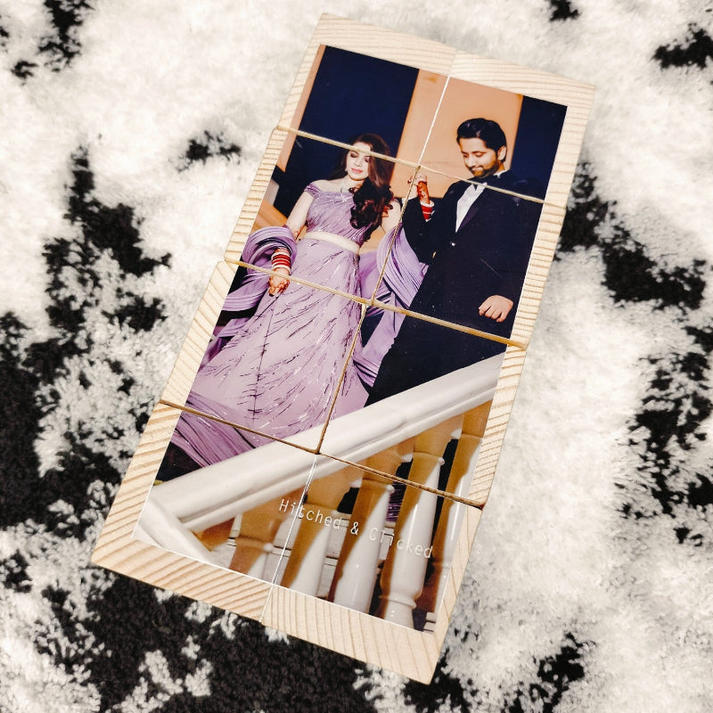 Wooden photo frame with a couple's portrait on a snowy background