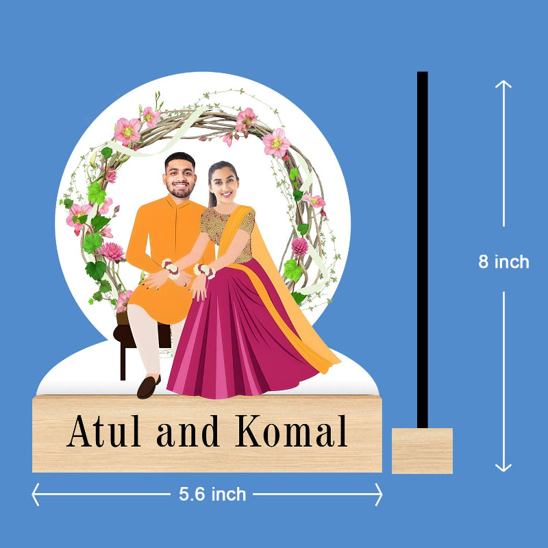 Decorative plaque with a couple's portrait, floral design, and dimensions on a blue background.