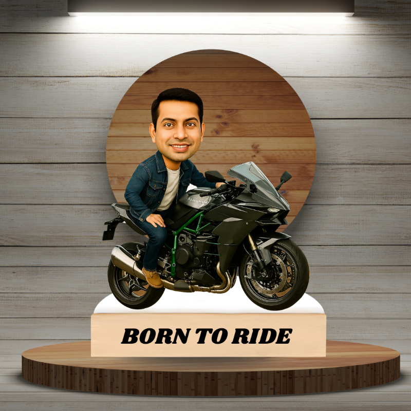 Bobblehead of a person on a motorcycle with 'Born to Ride' text against a wooden background