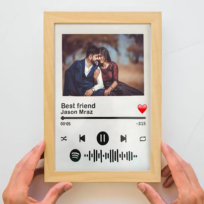 Framed artwork with a couple's photo, music player interface, and 'Best friend Jason Mraz' text.