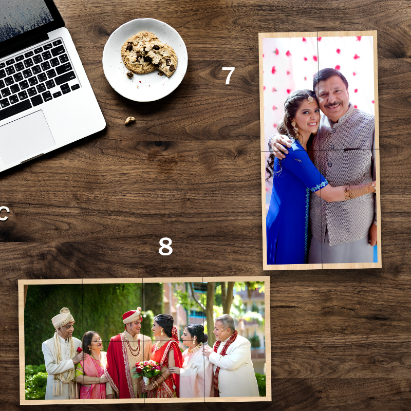 Laptop, cookies, and a photo collage of a couple on a wooden surface.