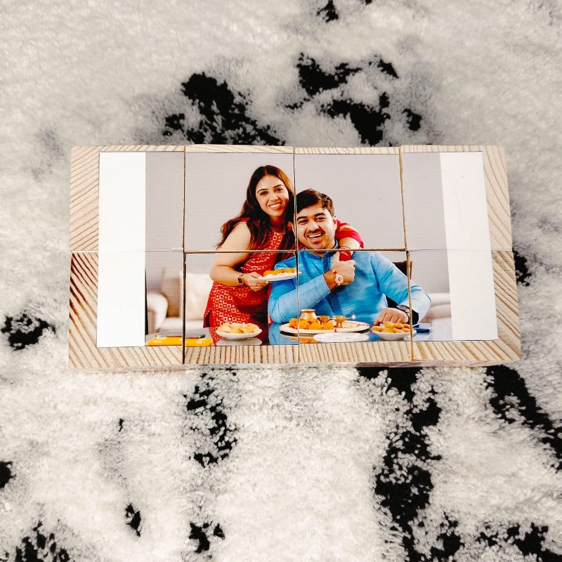Wooden photo mosaic with a couple at a table on a snowy background