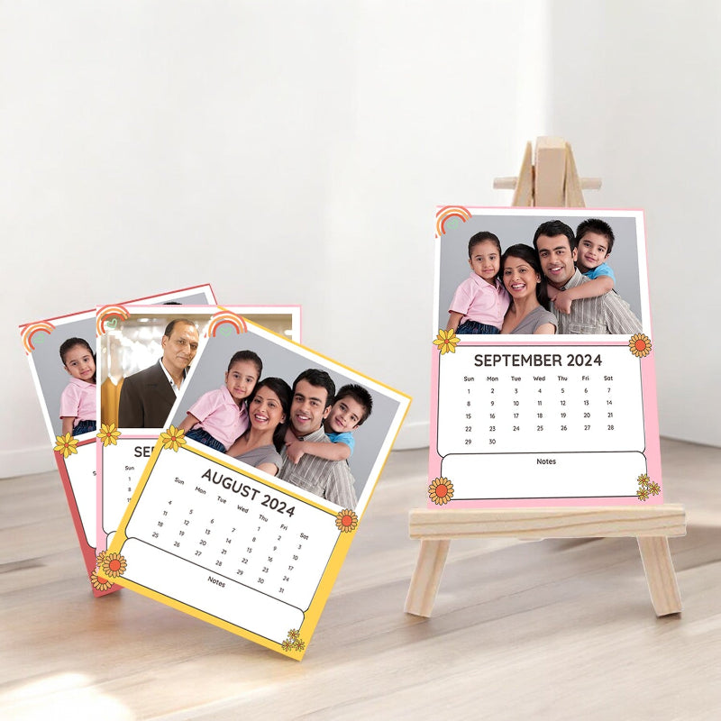 Two photo calendars on stands with family photos and dates displayed.