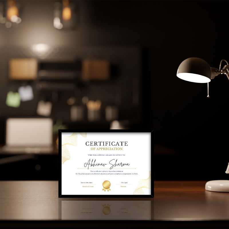 Framed certificate on a desk with a blurred office background