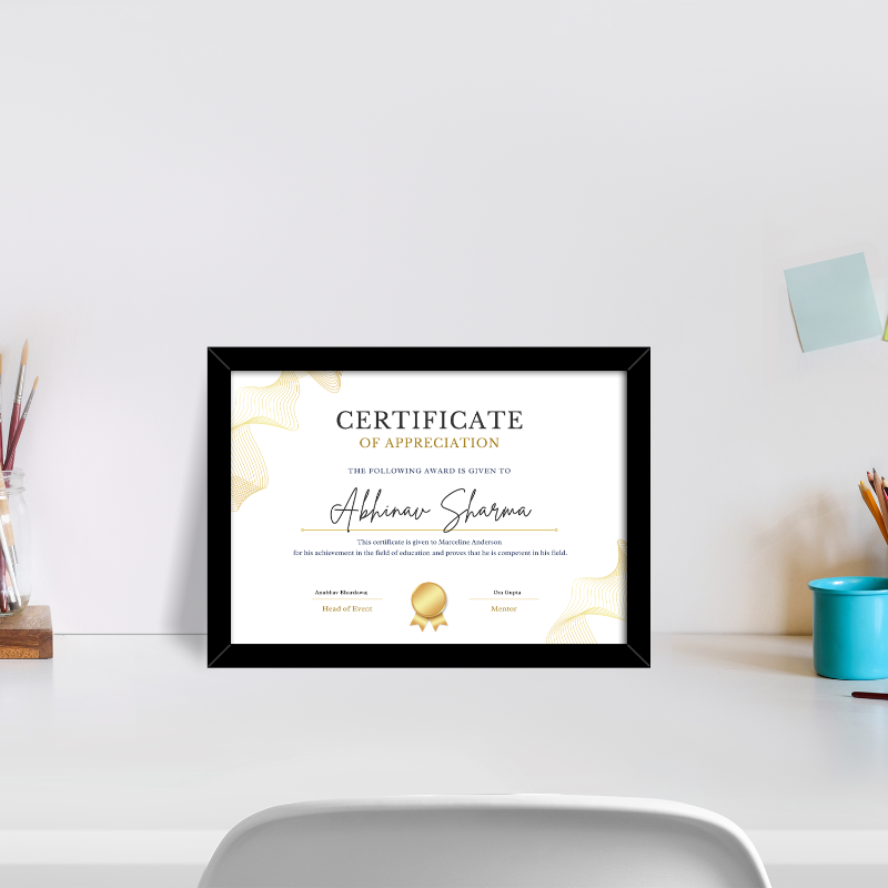 Framed certificate of appreciation on a desk with office supplies in the background