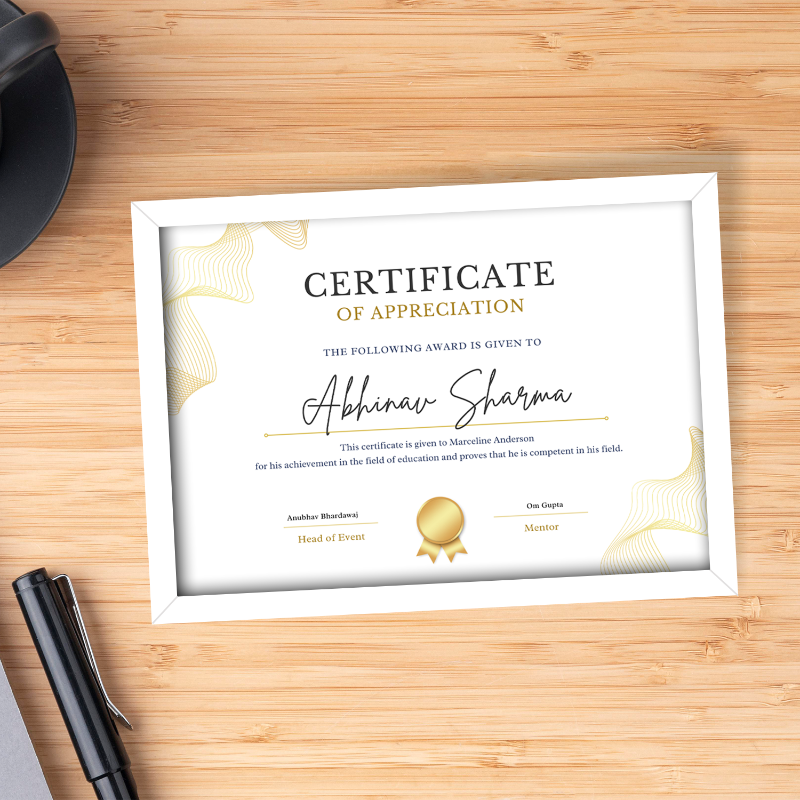 Certificate of Appreciation on a wooden surface with a pen and a black object.