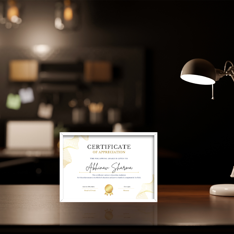 Framed certificate of appreciation on a desk with a blurred office background