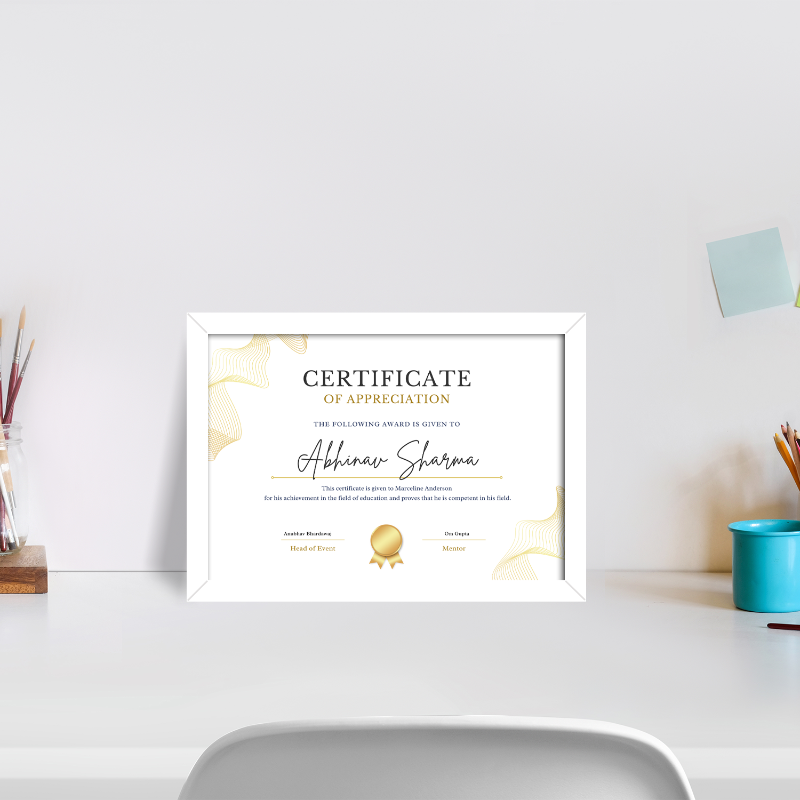 Framed certificate of appreciation on a desk with office supplies in the background