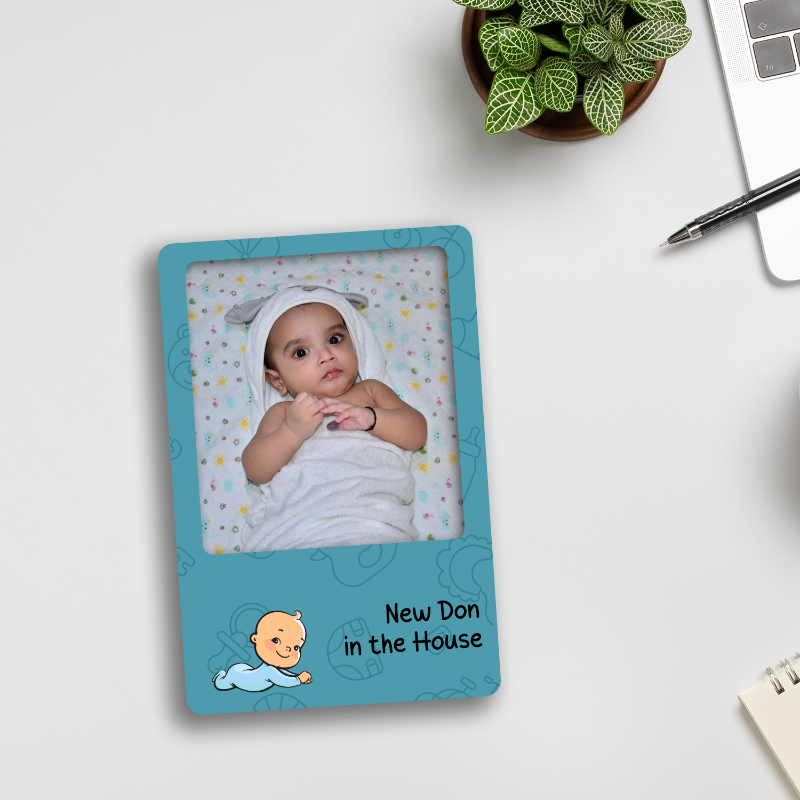 A personalized fridge magnet with a photo of a baby and the text 'New Don in the House'.