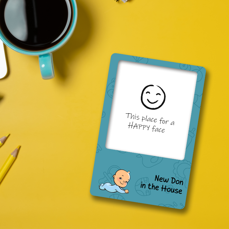Small electronic device with a smiley face and text on a yellow background
