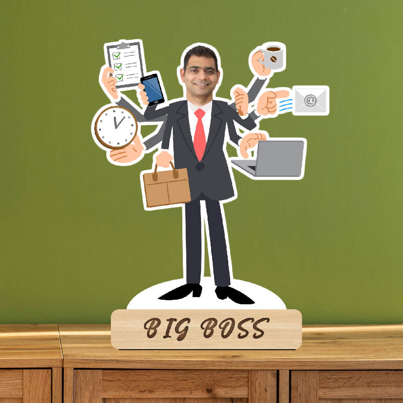 Figurine of a businessman with multiple arms holding icons on a wooden base labeled 'BIG BOSS' against a green wall.
