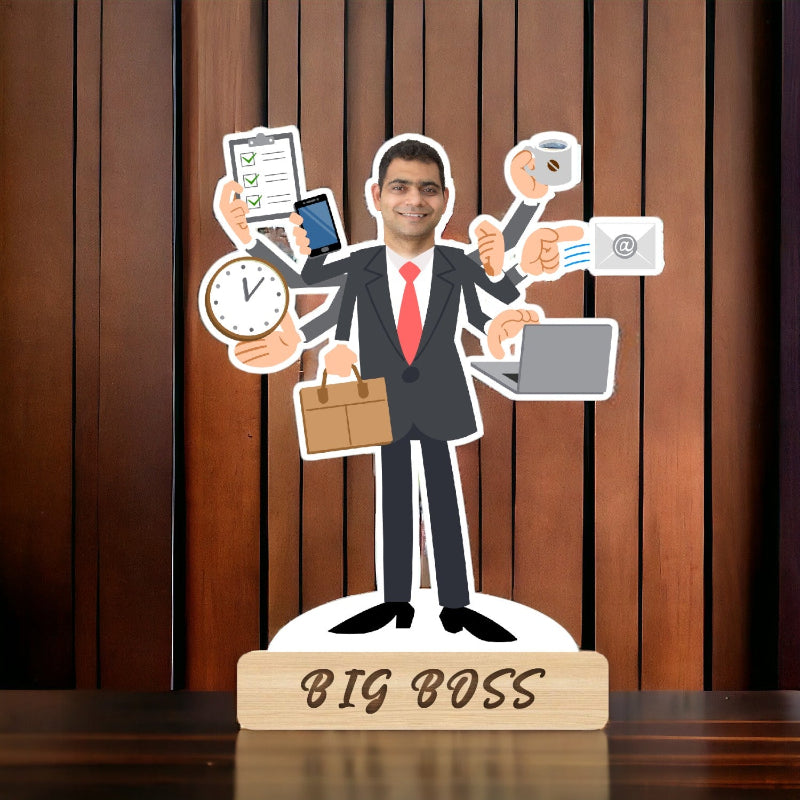 Decorative figure of a businessman with multiple arms holding various items on a wooden stand with 'BIG BOSS' text, against a wooden panel background.