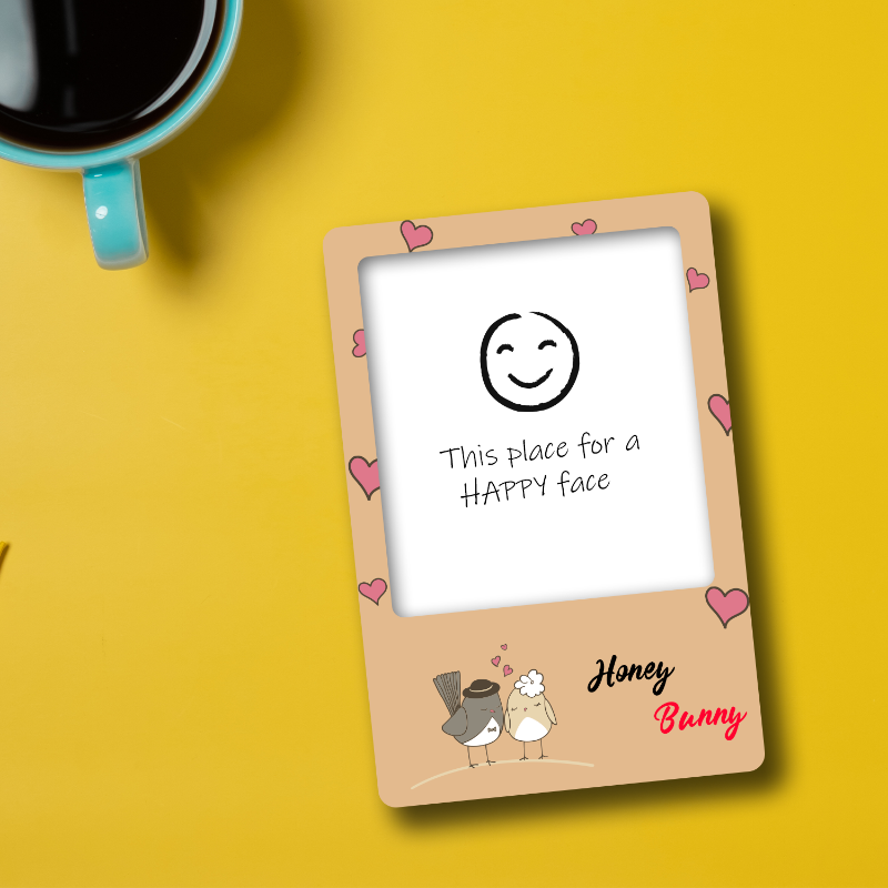 Framed card with a smiley face illustration and text on a yellow background with a coffee cup.