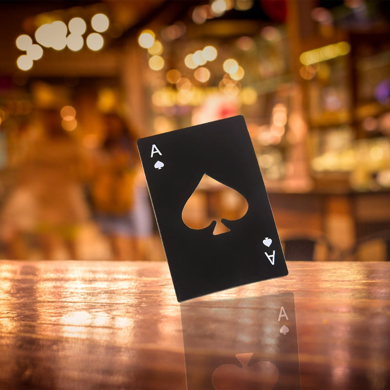 Ace of stainless steel bottle openeron a wooden table with a blurred bar background